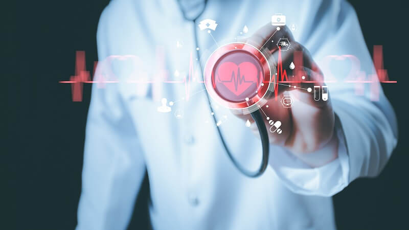Stethoscope over a graphic of a heartbeat