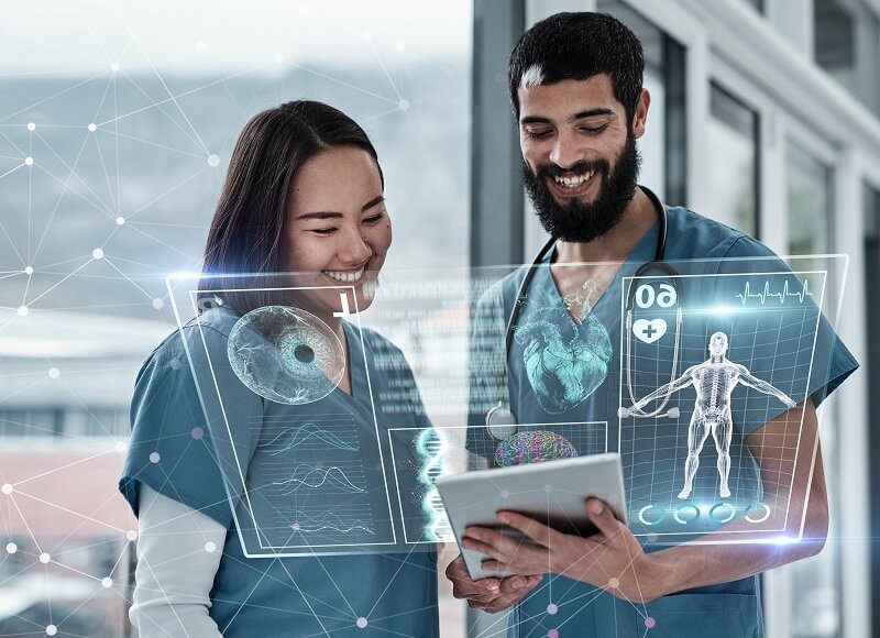 Two nurses reviewing a digital medical chart