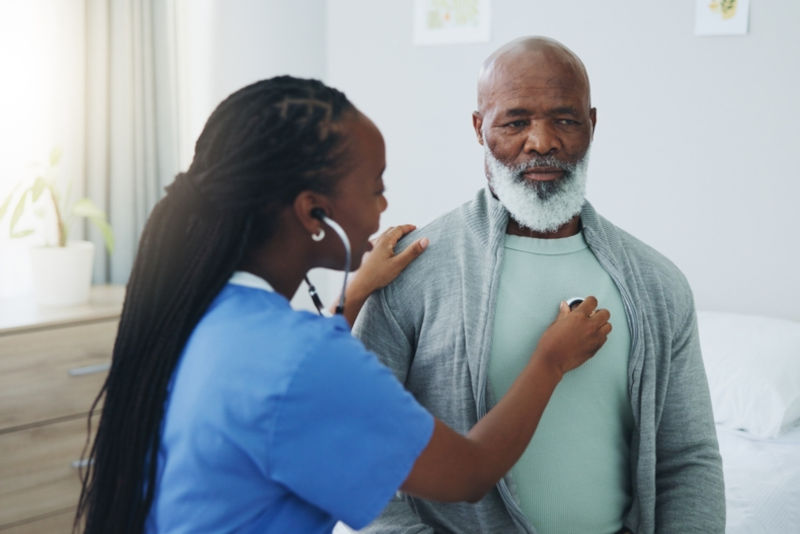 A nurse performing a health assessment on their patient