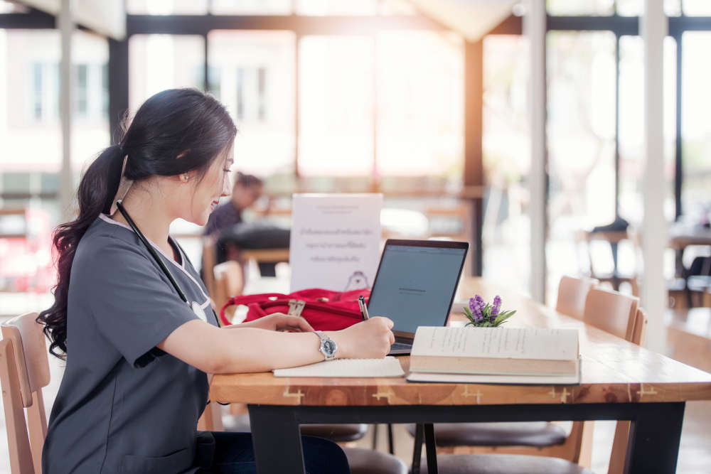 A nursing student doing online coursework