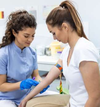 A nurse preparing to give an injection during her clinical rotation