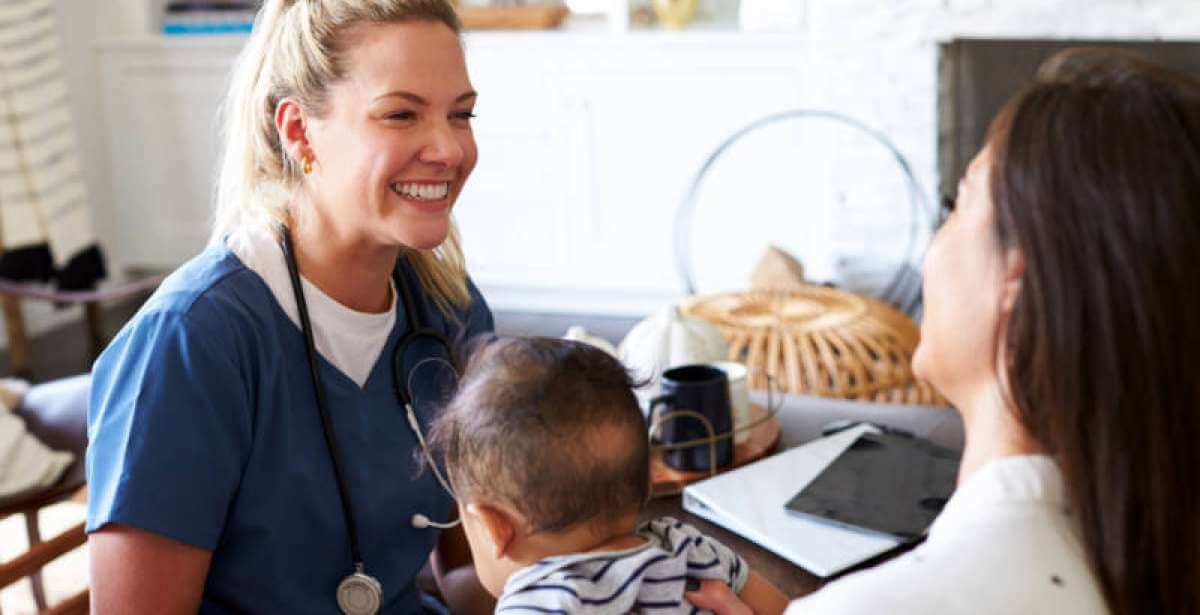 A second career nurse caring for a mother and her baby