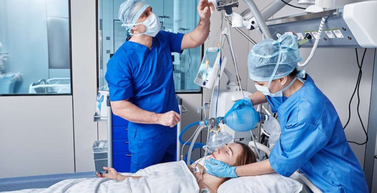 ICU nurses treating a patient