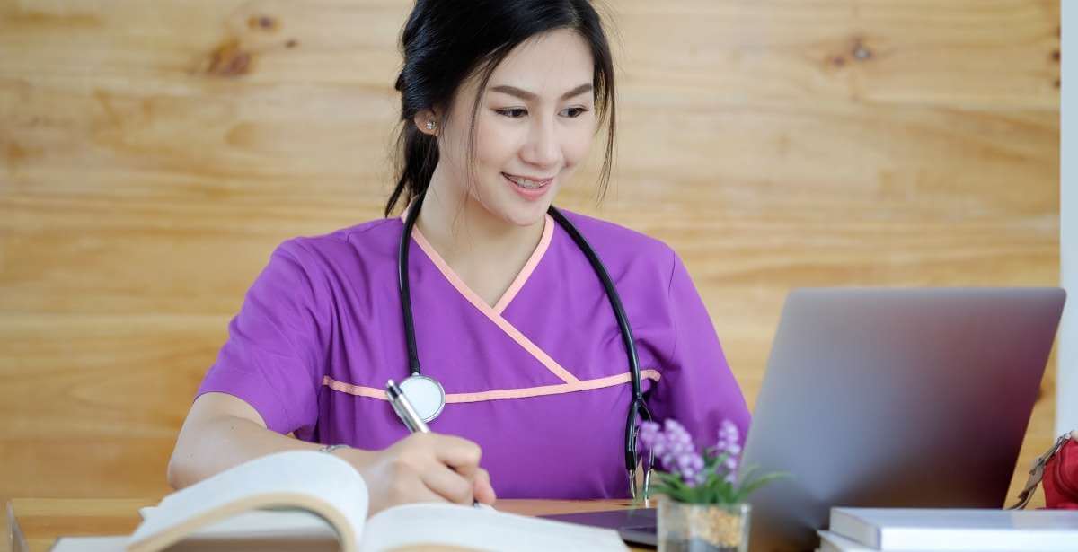 Nursing student studying at computer
