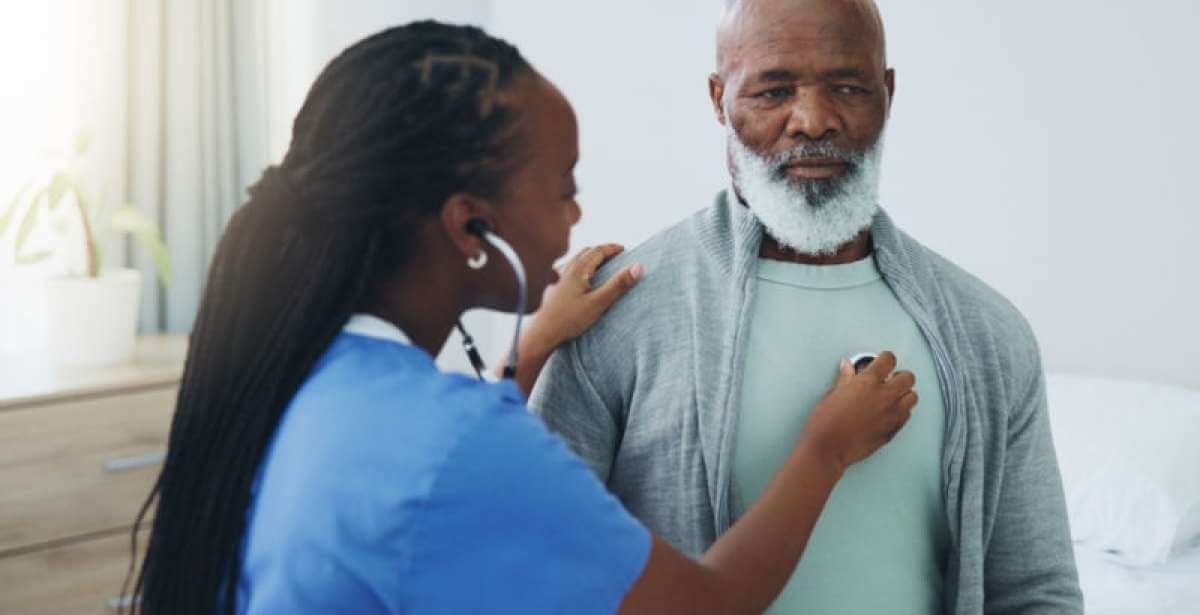 A nurse performing a health assessment on their patient
