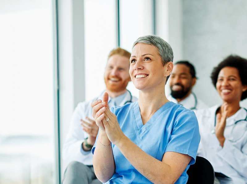 A group of nursing students sitting in a classroom