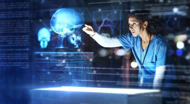 Nurse looking at an xray of a skull